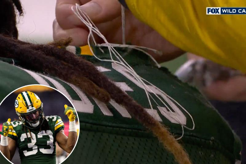 Aaron Jones jersey sewn together after falling apart during monster first half vs. Cowboys