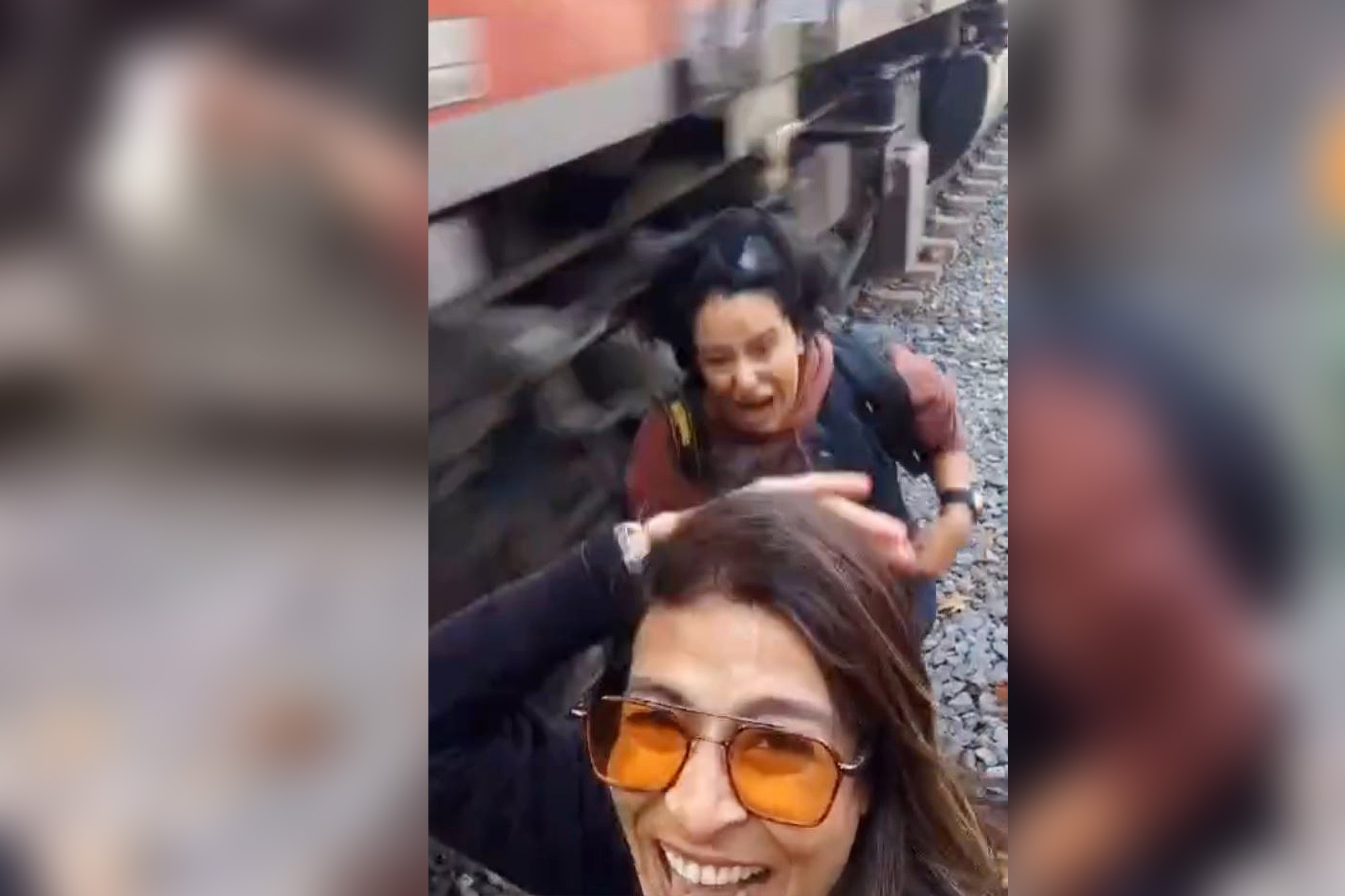 Woman posing for selfie inches from tracks struck by oncoming train ...